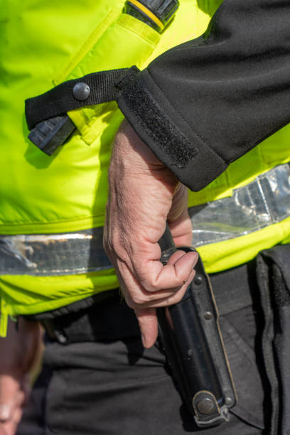 istock UK police officer removing an asp 2181692091