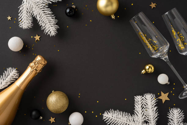 istock A festive New Year's Eve setting featuring champagne, baubles, white branches, and star confetti on a dark background, creating a celebratory atmosphere 2181692384