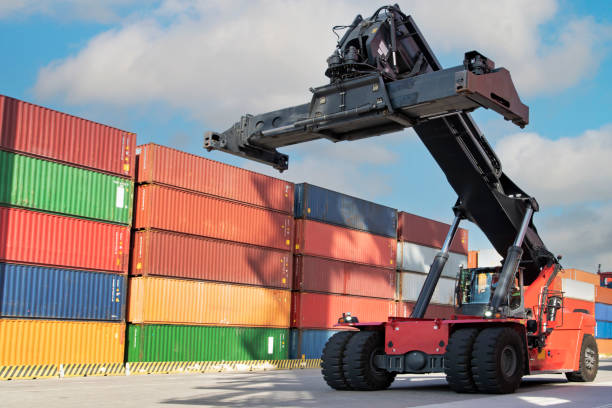 istock Crane ready for lifting up container in commercial port. 2181693397