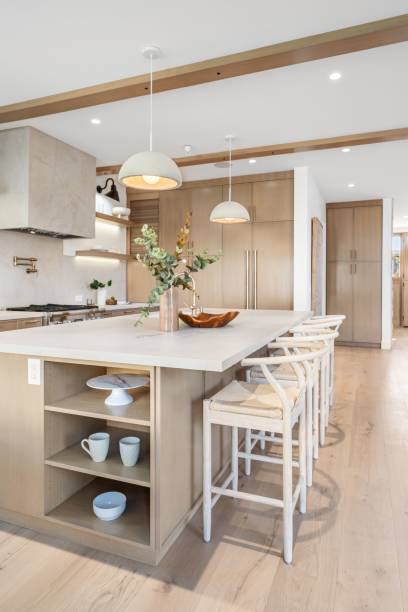 istock Modern kitchen interior with wooden cabinets and island. 2181694000