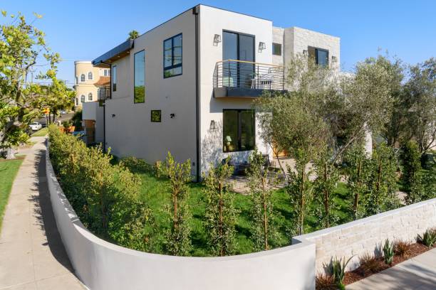 istock Modern house with lush garden in suburb. 2181694090