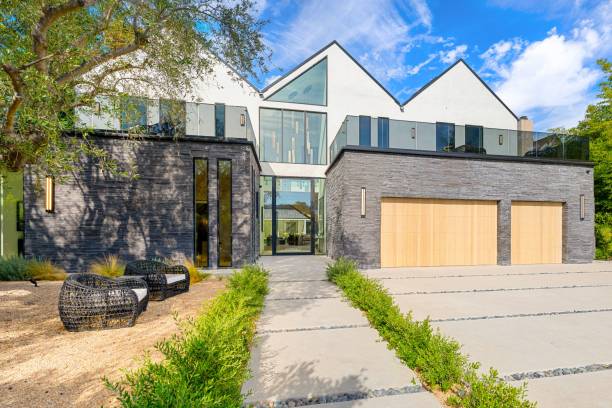 istock Modern luxury home exterior with stone facade. 2181694177