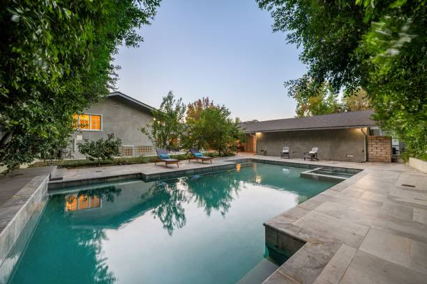 istock Modern backyard with a luxurious swimming pool. 2181694256