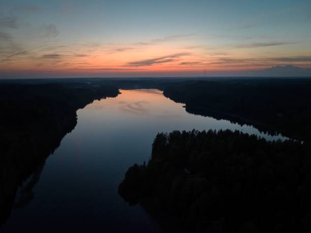 istock Aerial view of river at sunset with colorful sky reflection. 2181695352
