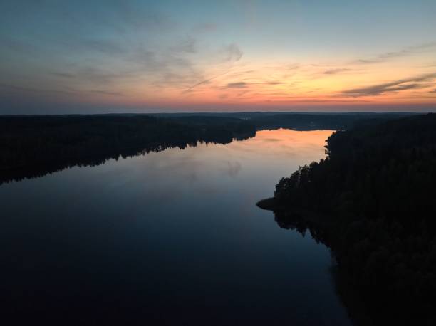 istock Serene sunset over tranquil lake and forest. 2181695357