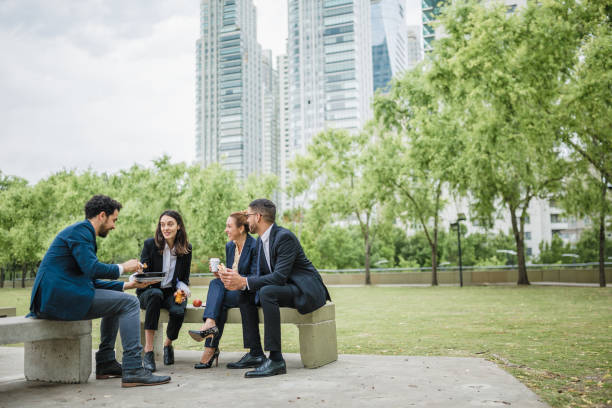 istock Team Members Enjoying Outdoor Lunch Break 2181698219