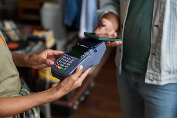 istock Holding payment terminal in front of man 2181699655