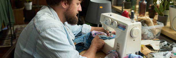 Stitching new pocket to blue jeans