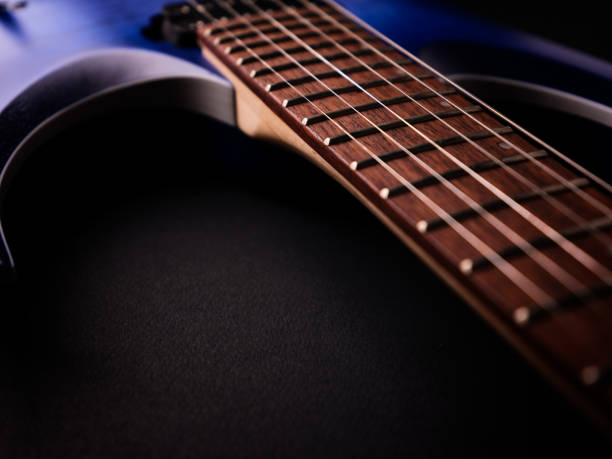 Fretboard of modern electric guitar. Close up.
