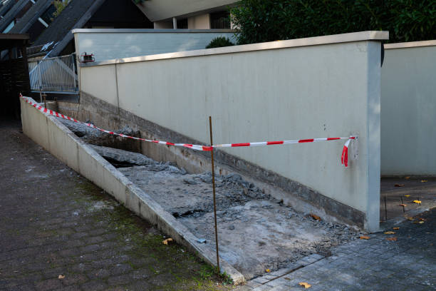 istock Pathway renovation with safety barriers in a residential area 2181707077