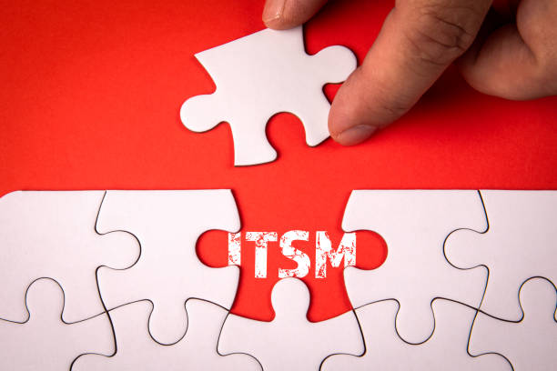 istock ITSM - Information Technology Service Management. White puzzle pieces on an red background 2181709530