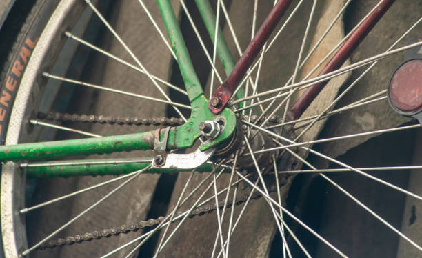 Green bicycle wheel. Bicycle spokes and bicycle wheel fasteners