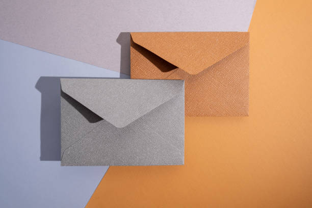 istock Paper envelopes on a light background. New mail, write a message. Send and receive mail. Postal delivery service. Empty envelope, empty space. Communication with people, paperwork. Envelope close-up 2181717116