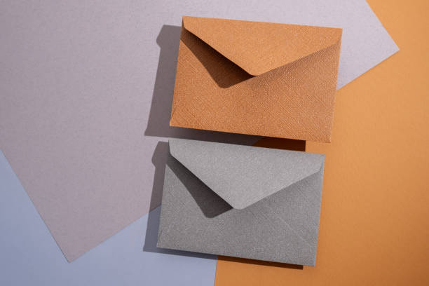 istock Paper envelopes on a light background. New mail, write a message. Send and receive mail. Postal delivery service. Empty envelope, empty space. Communication with people, paperwork. Envelope close-up 2181717148