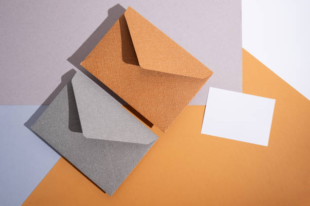 istock Paper envelopes on a light background. New mail, write a message. Send and receive mail. Postal delivery service. Empty envelope, empty space. Communication with people, paperwork. Envelope close-up 2181717172