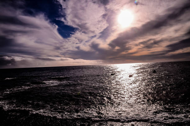 istock The sky is cloudy and the sun is shining on the water 2181717497