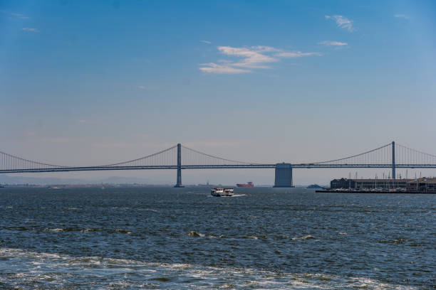 Point of view through the structure of the bridge over the Tagus with a freighter in progress