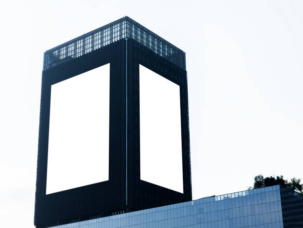 istock Mock up two white vertical LED display billboard on tower building. Clipping path for mockup 2181721745