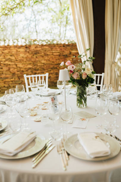istock Table setting for an event party or wedding reception. Fresh flower table decoration 2181725752
