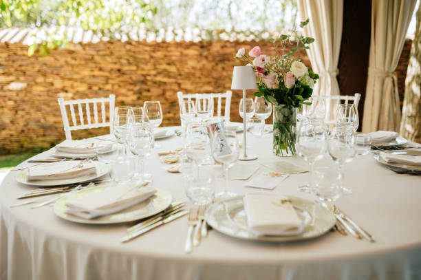 istock Table setting for an event party or wedding reception. Fresh flower table decoration 2181725753