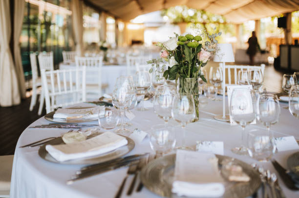 istock Table setting for an event party or wedding reception. Fresh flower table decoration 2181725754