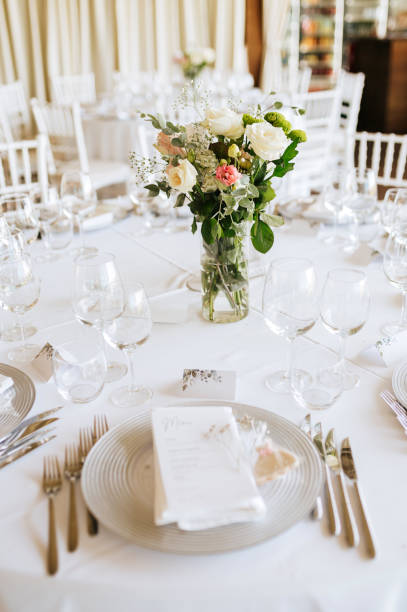 istock Table setting for an event party or wedding reception. Fresh flower table decoration 2181725756