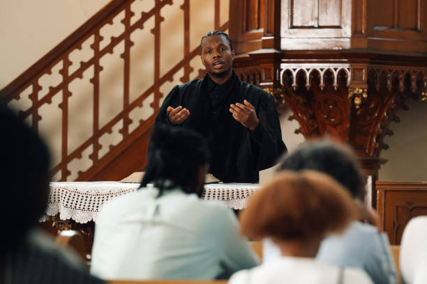 istock Young pastor delivering sunday sermon from the pulpit 2181729098