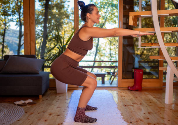 istock Doing yoga in a wooden cottage 2181729339