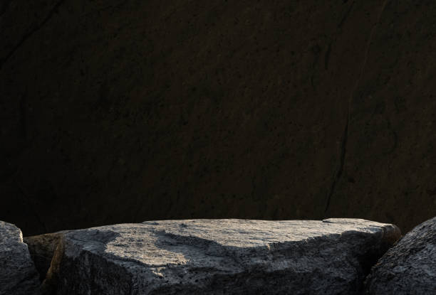istock Stone Rock Podium on Black Cement Stone Wall for Product present,Studio Background with  light on Clifft Rock stand Display Design,Empty Backdrop Background for Black Friday or Spa,Cosmetic promotion 2181731929