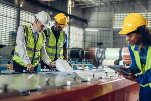 istock Foreman or worker work at factory site check up machine or products in site. 2181731975