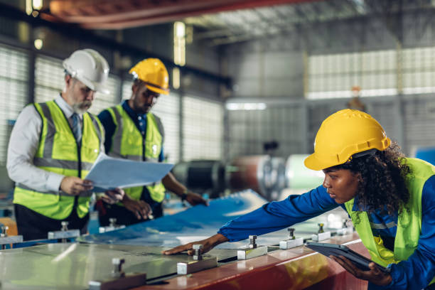 istock Foreman or worker work at factory site check up machine or products in site. 2181731983