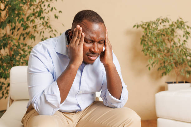 istock Stressed Man Holding Head in Discomfort 2181732917