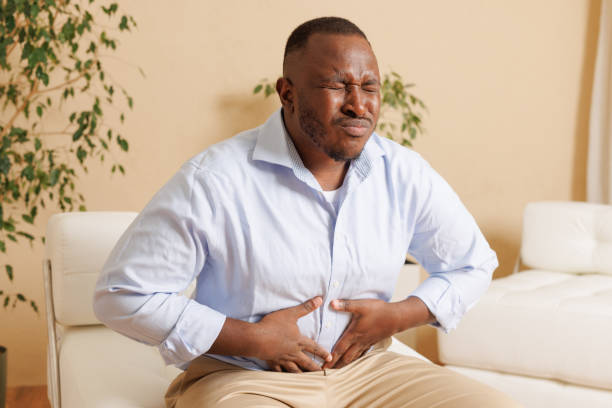 istock Mature man suffering from bellyache at home 2181732927