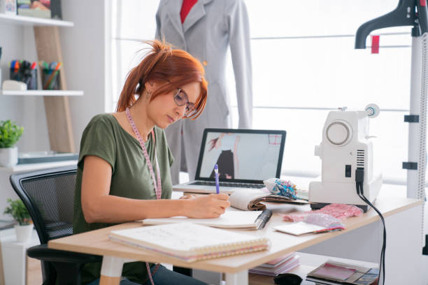 istock Fashion designer working at her atelier 2181733032