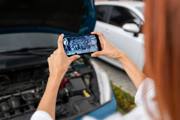 istock Woman having car problems and recording a video for her mechanic 2181733195
