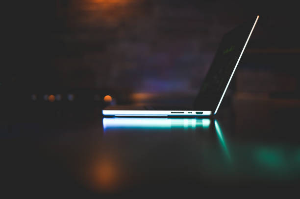 istock Close up side view of laptop in silhouette. 2181737242