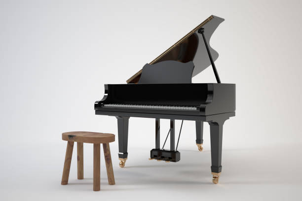 istock Black grand piano with open lid and wooden stool. 2181737289