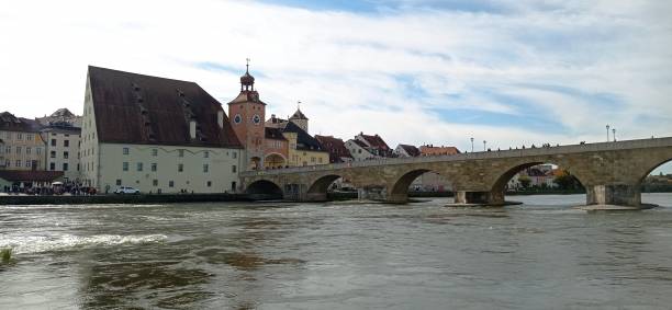 istock Old stone bridge over river Danube in Regensburg, Germany. 2181737418