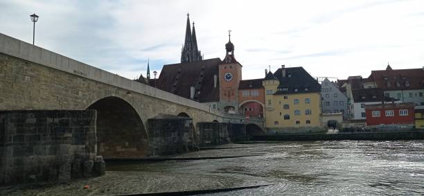 istock Old stone bridge over river Danube in Regensburg, Germany. 2181737428