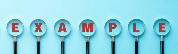 istock Example inscription on a magnifying glass on a blue background 2181740808