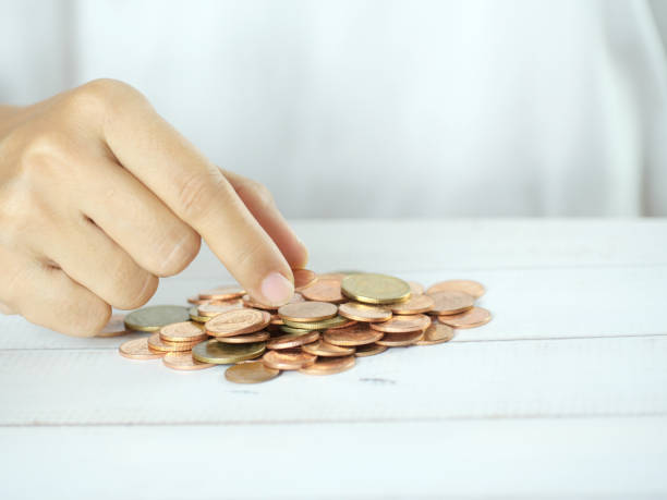 istock Hands counting coins on white background. Finance business concept. Copy space. 2181742620