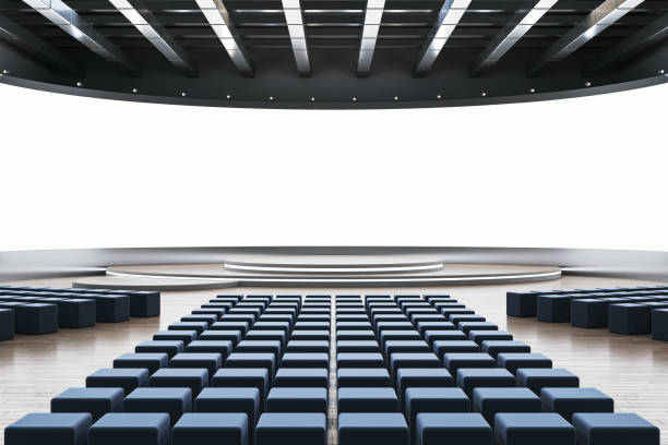 istock Modern auditorium interior with blue seats and large stage in front of a blank screen. 3D Rendering 2181746009
