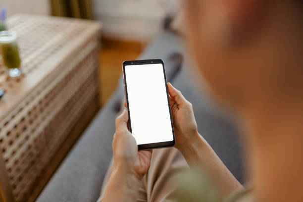 istock Mockup Image Blank White Screen Cell Phone in Woman Hands 2181748780