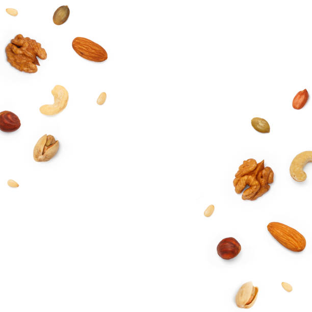istock Square shape background from various nuts and seeds with copy space for text. Isolated on white background 2181749684