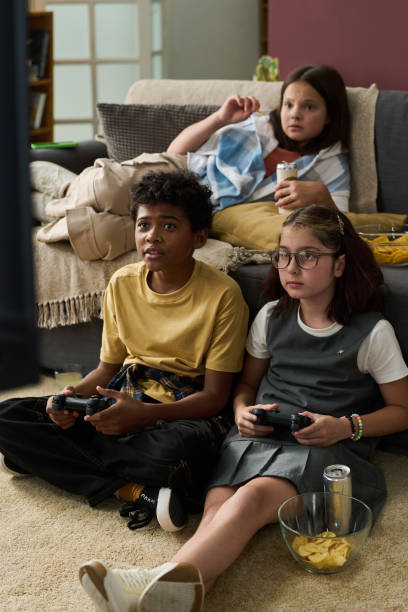 istock Playing Video Games with Friends on Couch at Home 2181750793