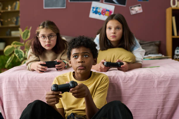 istock Playing Video Games Together in Cozy Living Room Setting 2181750818