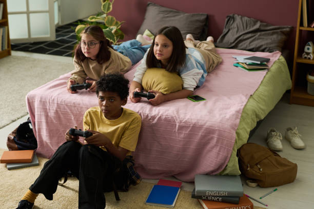 istock Three Friends Enjoying a Video Game Session Together 2181750830