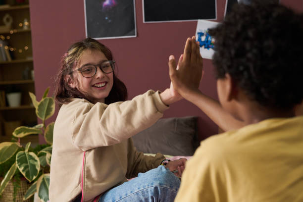 istock Celebrating Achievement with a High Five Indoors 2181750849