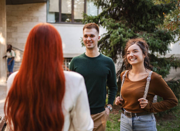 istock Students engaged in lively conversation outdoors on a sunny day at their university campus, sharing laughter and ideas 2181753439