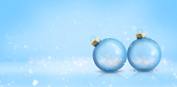istock Christmas bauble decoration on light blue snowy background. Festive winter holiday backdrop with copy space. 2181754103
